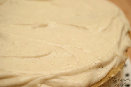 A cake topped with Cinnamon and Honey Cream Cheese Frosting