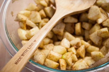 Chunks of chopped apple, covered in spices