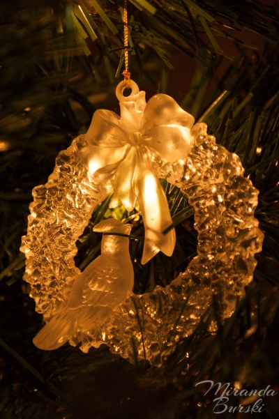 A Christmas decoration featuring a bird on a wreath