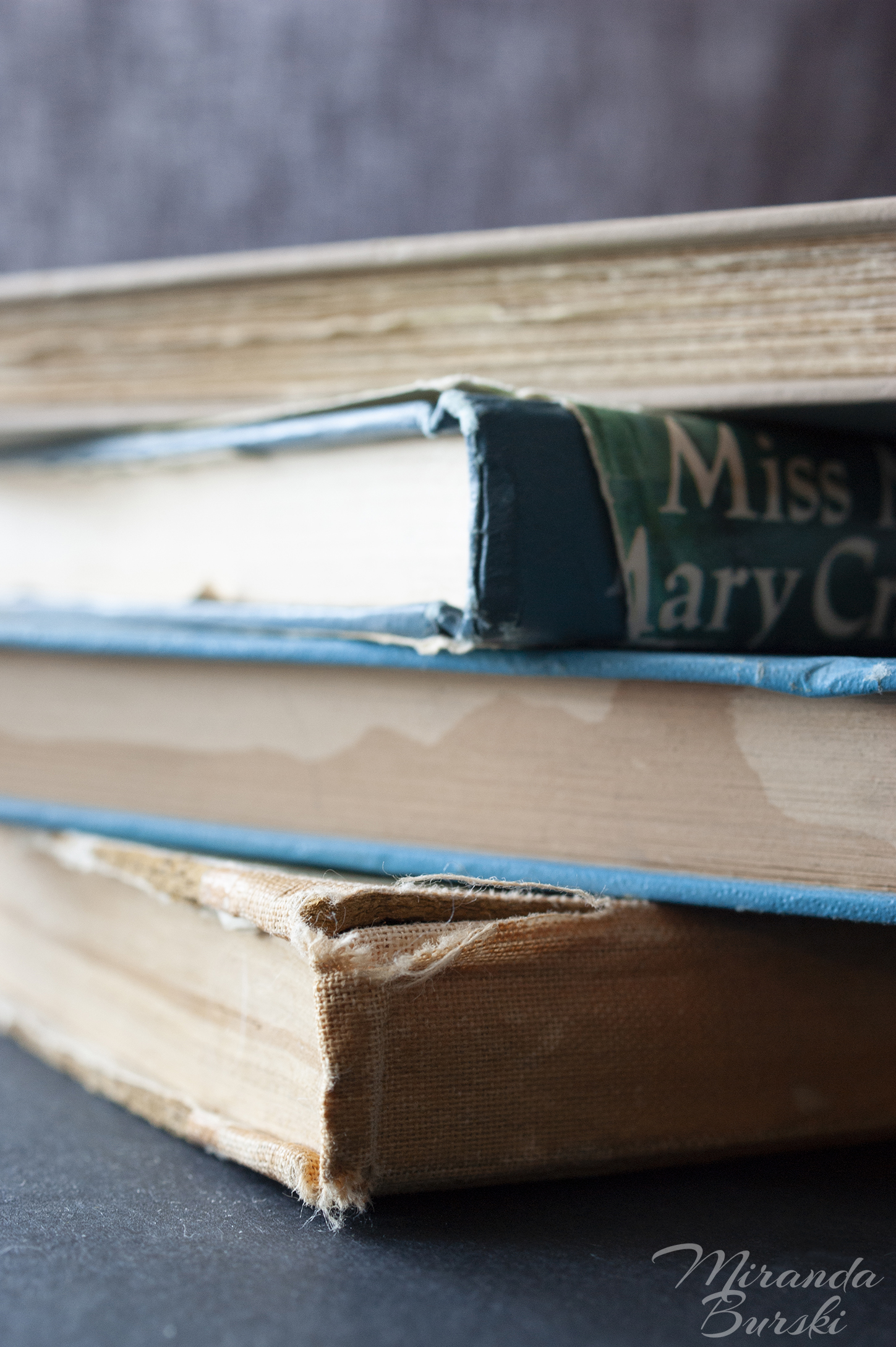 A pile of old, aged books.