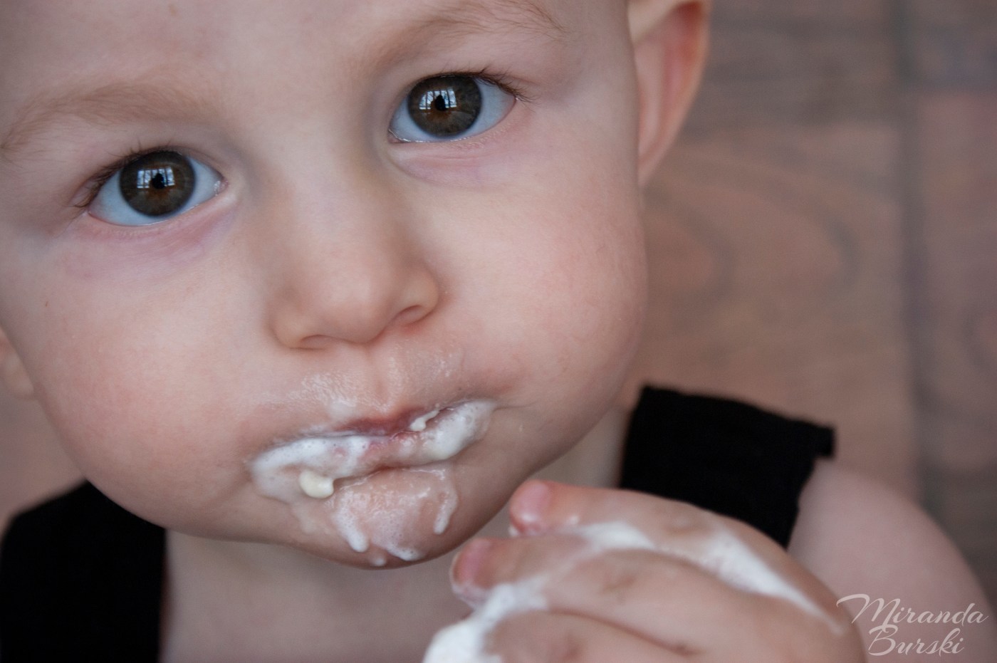 A baby during a cake smash photo shoot.
