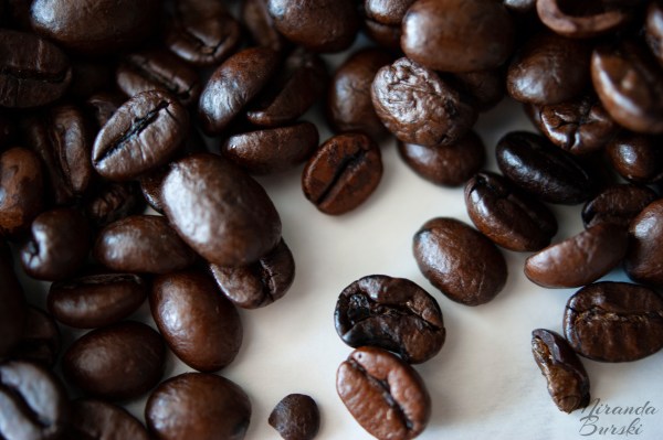 A collection of coffee beans on a white background.