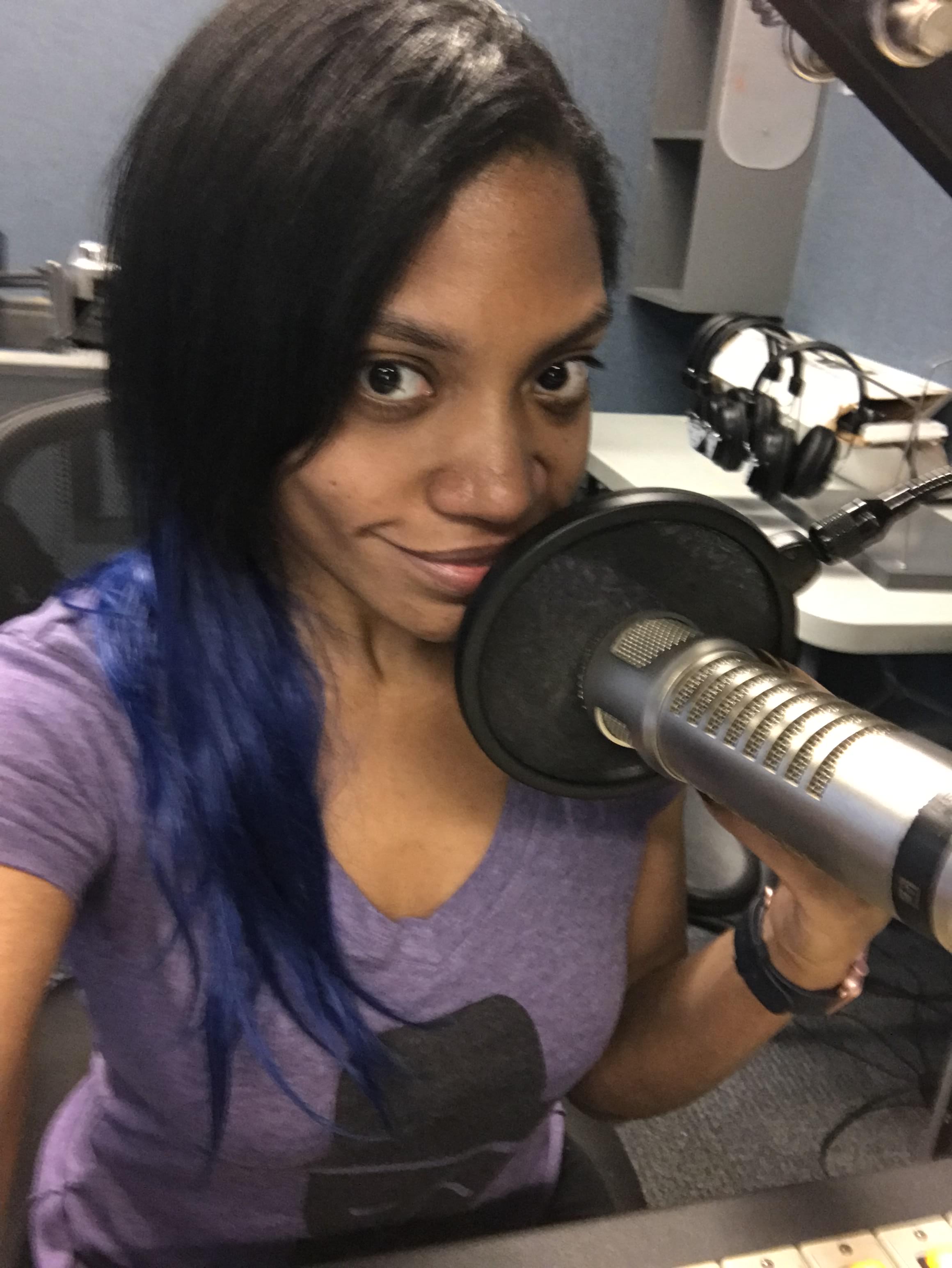 Author Leslie DJ behind a mircrophone