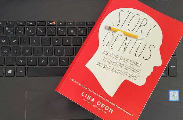 Story Genius, by Lisa Cron, on a laptop keyboard.