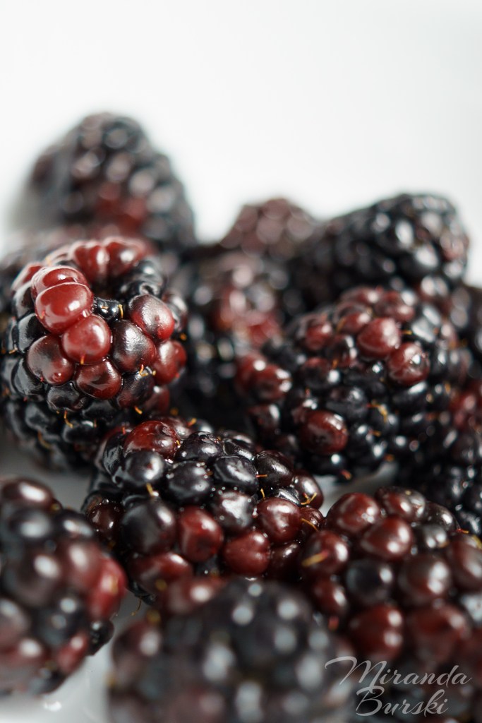 A close-up of freshly washed blackberries.